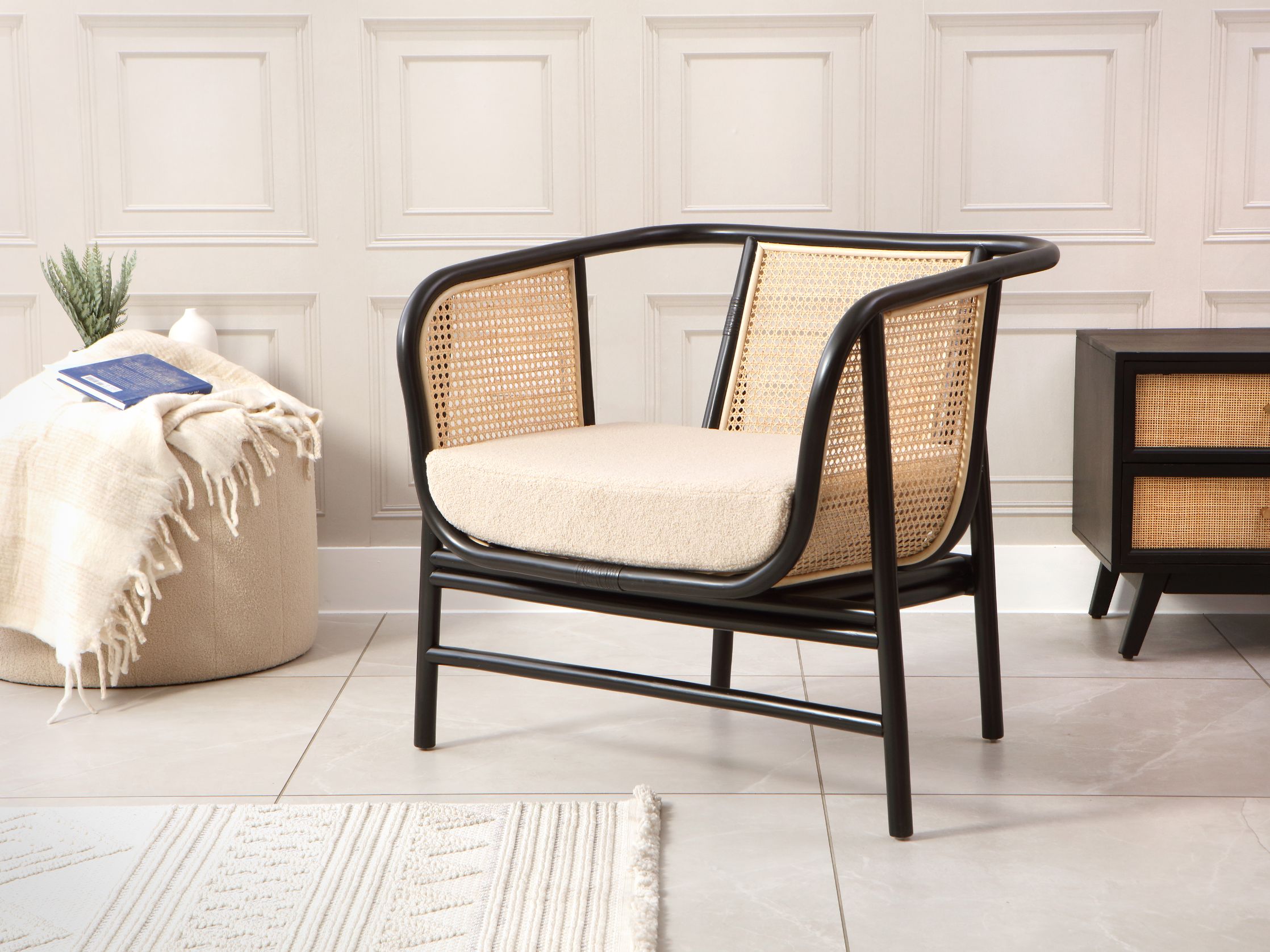 Rattan Chairs: A Cozy Retreat Seoul Black Boucle Rattan Lounge Chair | Desser
