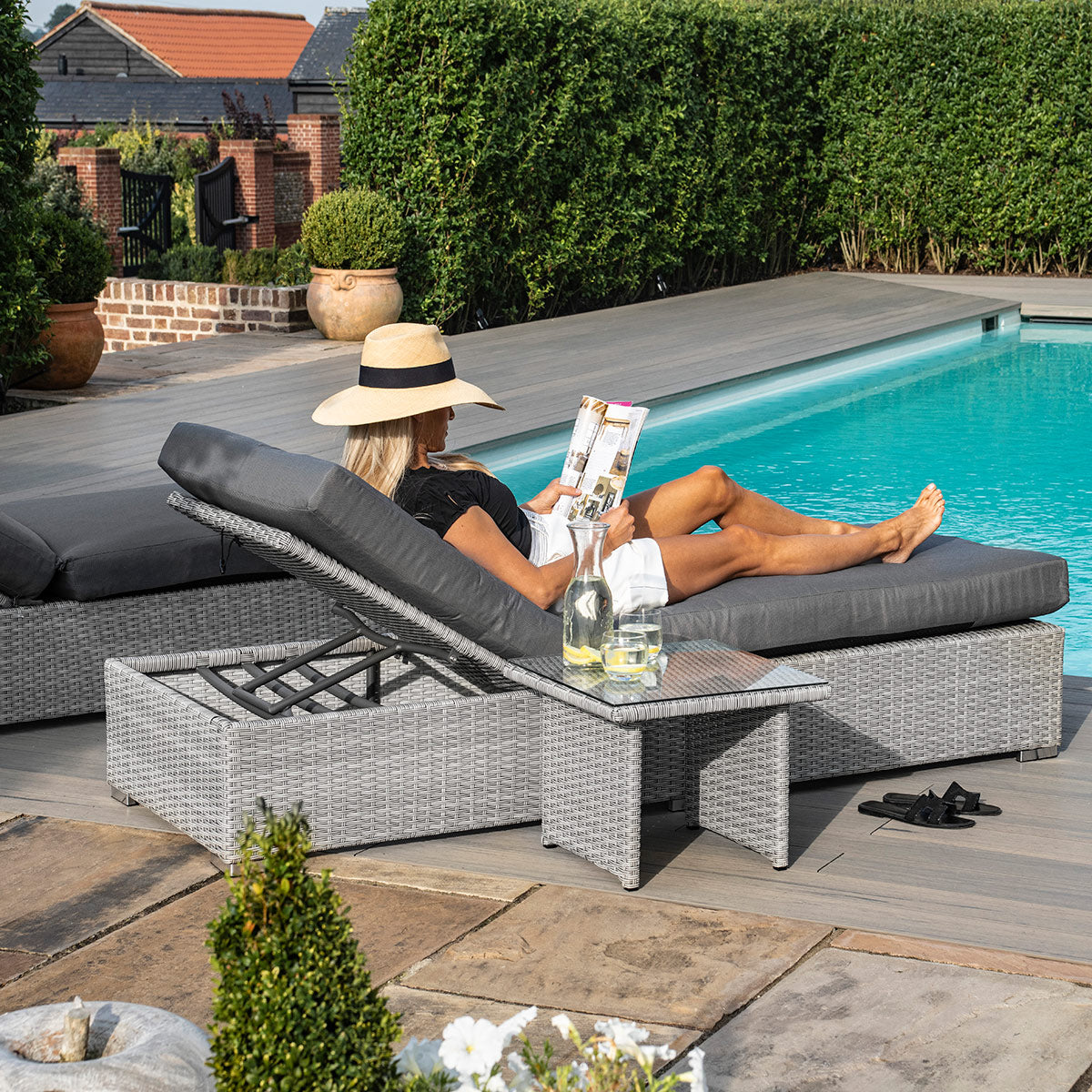 cartmel outdoor rattan sunlounger and side table set