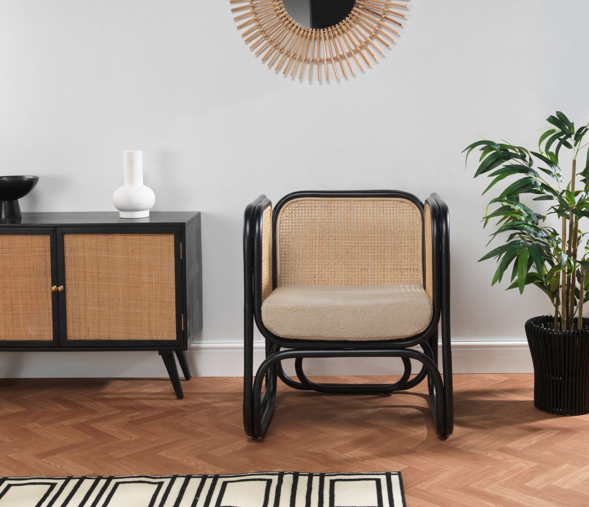 Black Rattan Iconic Chair with Boucle Cushion