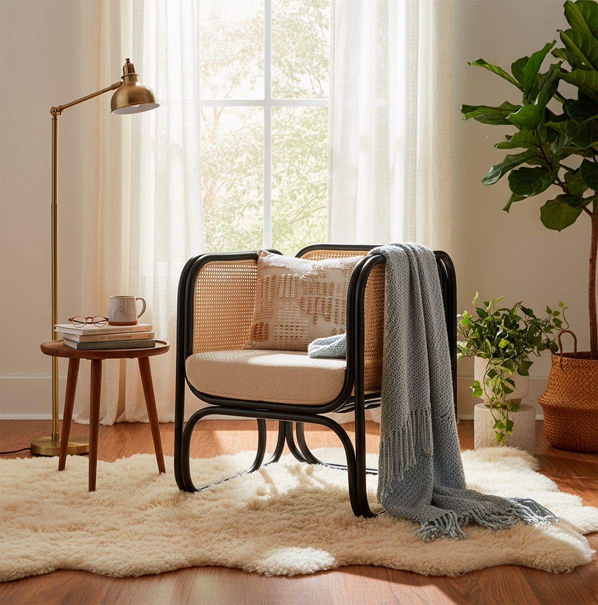 Black Rattan Iconic Chair with Boucle Cushion