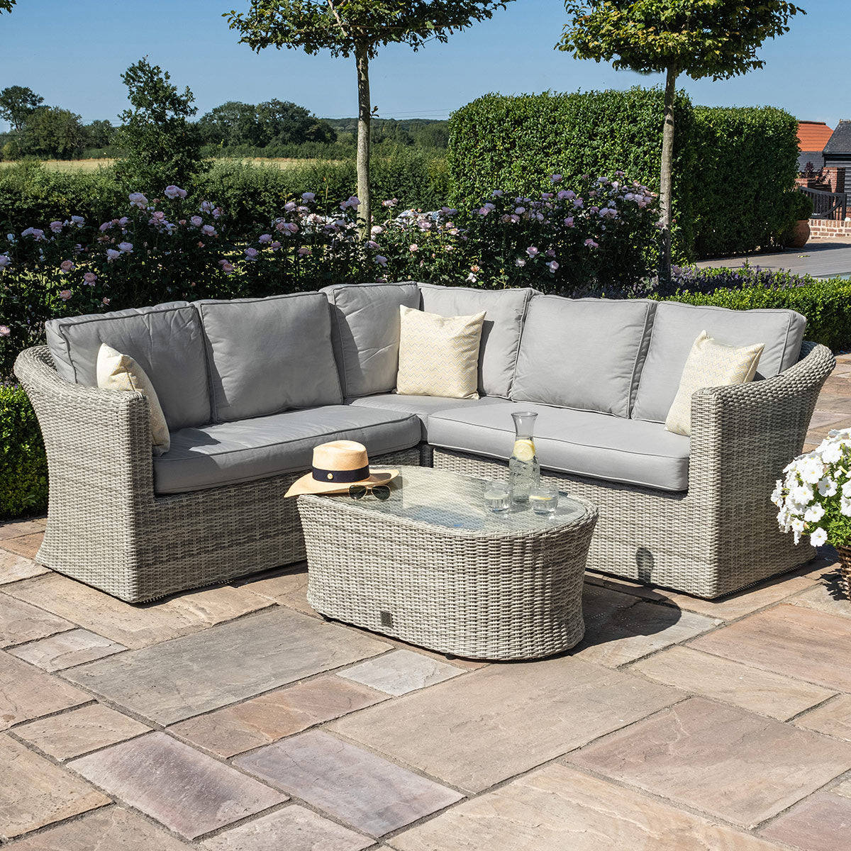 grasmere outdoor rattan small corner sofa with oval coffee table