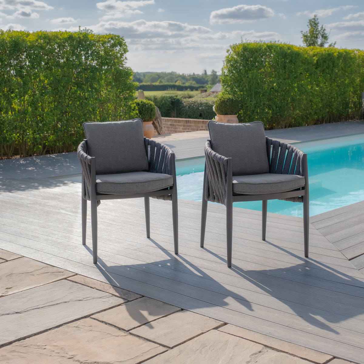 Suru Teak Round Dining Table With Milan Dining Chairs - Charcoal